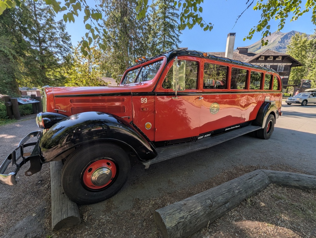 Red bus parked at Lake McDonald Lodge
