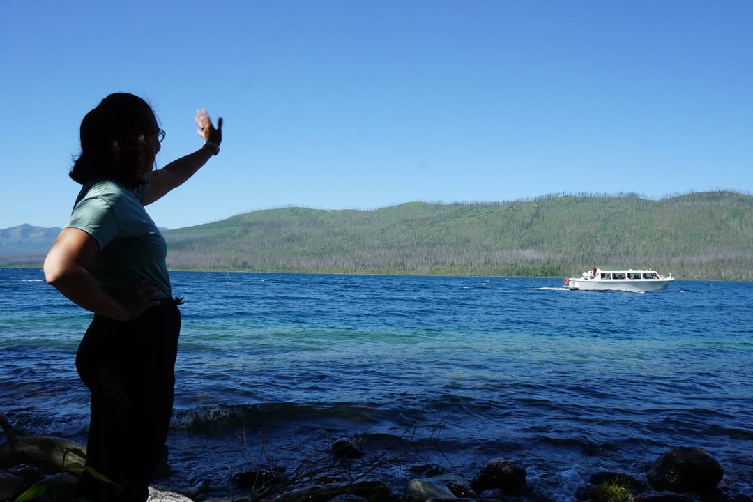 Waving at Boat on McDonald Lake