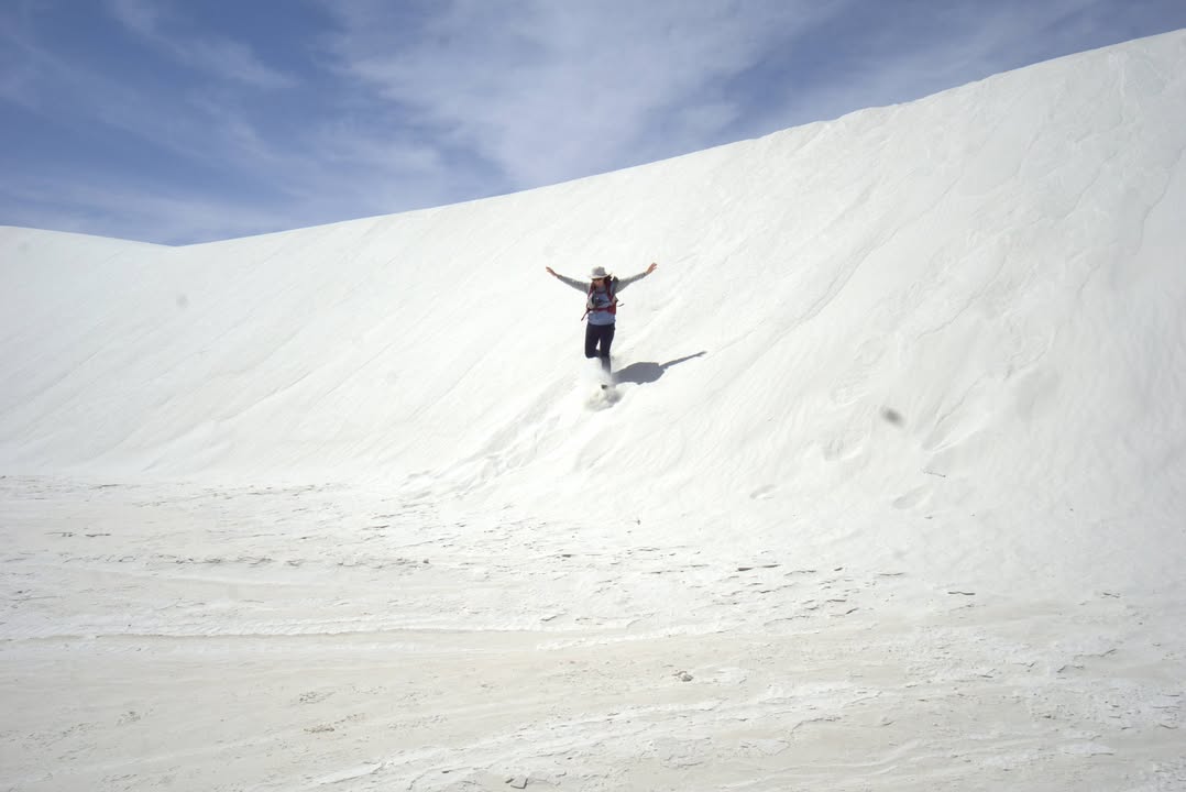 Running down a Dune on Alkali Flat Trail